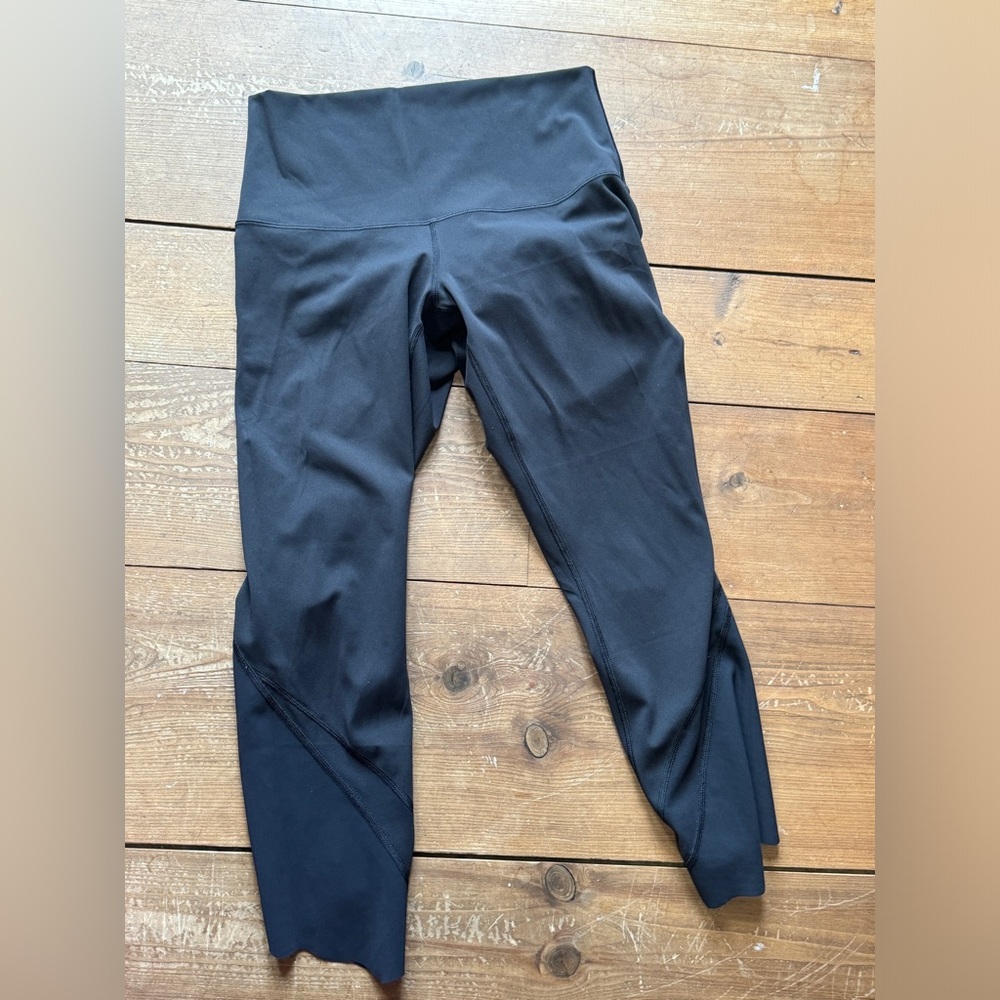 Black lululemon 7/8 leggings with scalloped edge and mesh